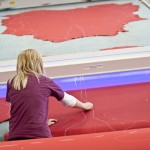 Worker marking out leather at Bridge of Weir Leather.