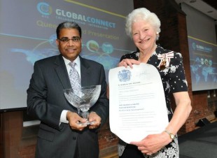 Dame Mary Peters, presents the award to Allstate's Suren Gupta.