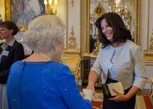 Jayne Taggart shakes hands with the Queen.