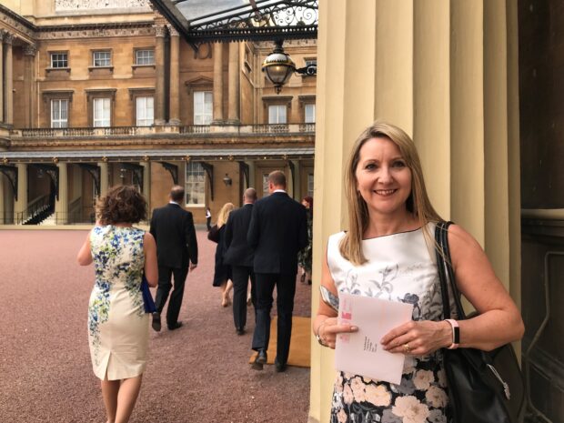 JTA staff crossing the courtyard at Buckingham Palace.
