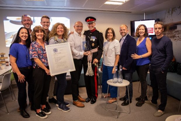 The Belu team being presented with he award by the Deputy Lord Lieutenant.