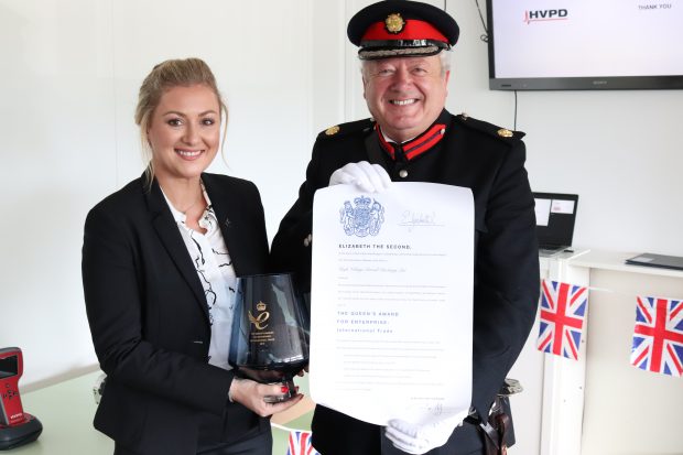 Rachel Oates receiving the Queen's Awards certificate from the Vice Lord Lieutenant