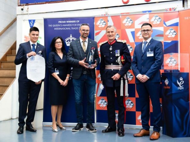 EasySkinz being presented with their Queen's Awards trophy by Lord Leutenant Nigel Atkinson Esq