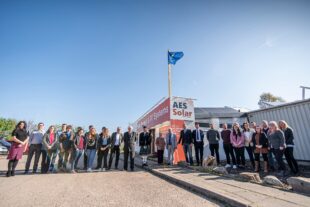 AES Solar flying Queen's Awards flag at their office