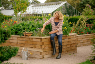 Woman sat on WoodBlox raised bed